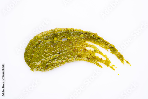 Delicious pistachio butter on white background