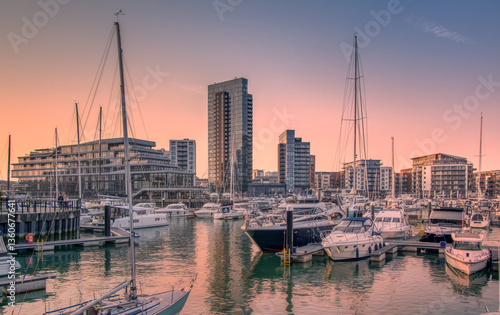 Ocean village marina in Southampton at dusk with the sun setting to the west