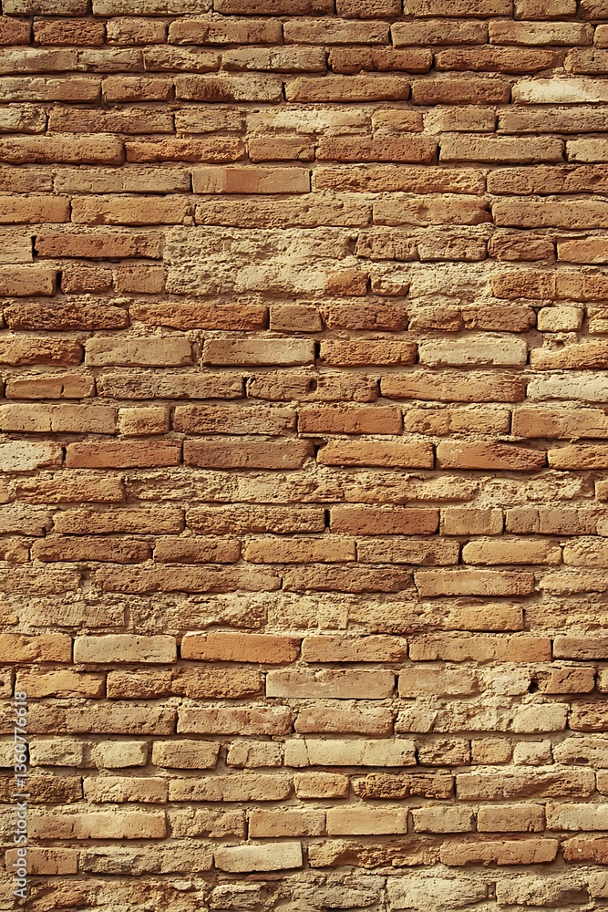 Obraz premium Distressed Brickwork Surface displaying Weathered Textures and Patterns