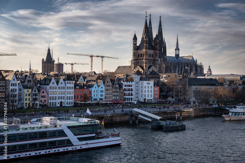 Cologne, Germany - March 7 2025: City skyline in spring along the Rhine river Cologne, Germany - March 7 2025: City skyline in spring along the Rhine river