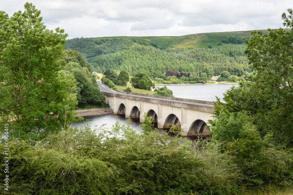 Empty arch road bridge in the mountains in northern England on a cloudy summer day Empty arch road bridge in the mountains in northern England on a cloudy summer day