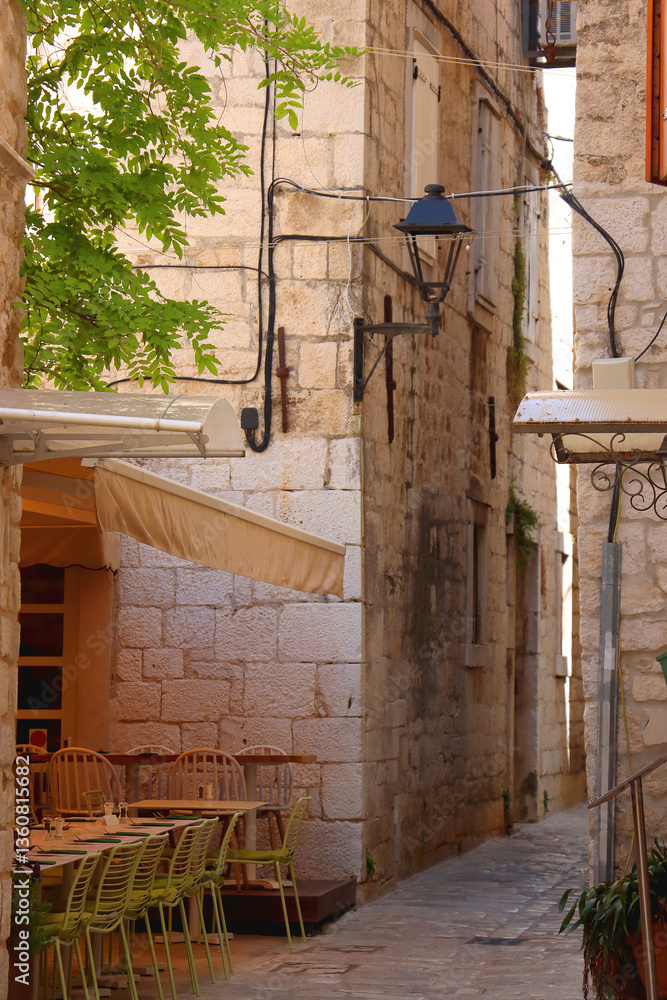 Picturesque Mediterranean street and traditional architectural details in Trogir, Croatia.