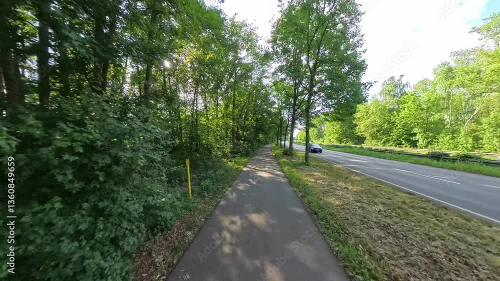 Enjoy a Scenic Nature Walk Alongside the Roadway, Surrounded by Lush Greenery and Beauty Hannover Enjoy a Scenic Nature Walk Alongside the Roadway, Surrounded by Lush Greenery and Beauty Hannover