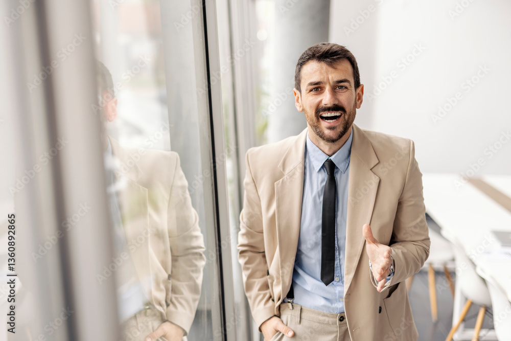Fototapeta premium Portrait of an executive standing in corporate firm and introducing himself.