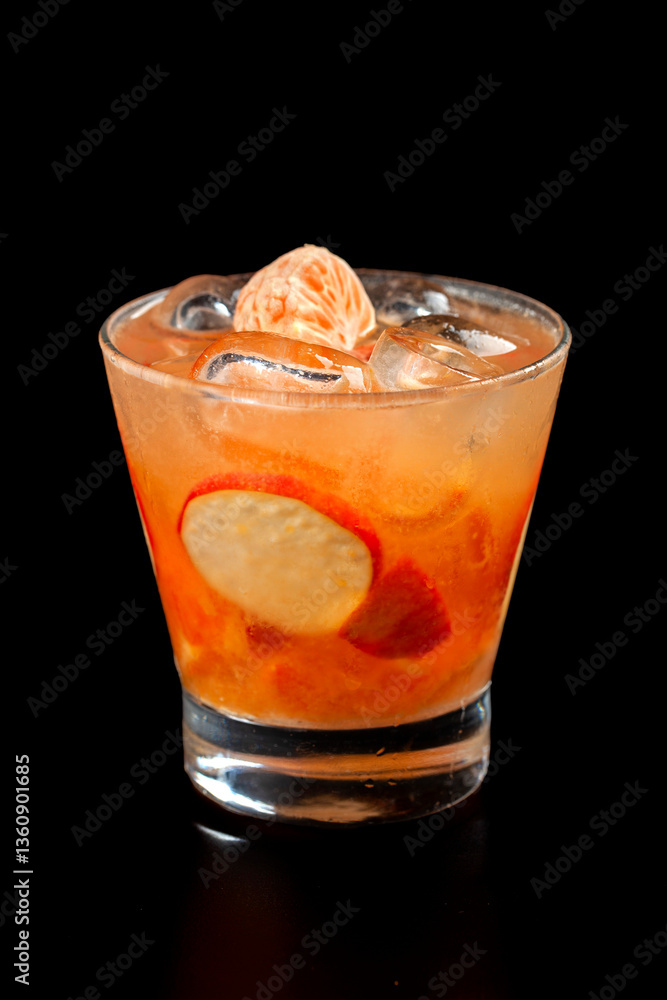 Refreshing fresh tangerine and cashew juice blend for a healthy drink option black blackground Refreshing fresh tangerine and cashew juice blend for a healthy drink option black blackground