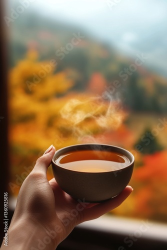 Hands holding hot tasty tea. Healthy drink.