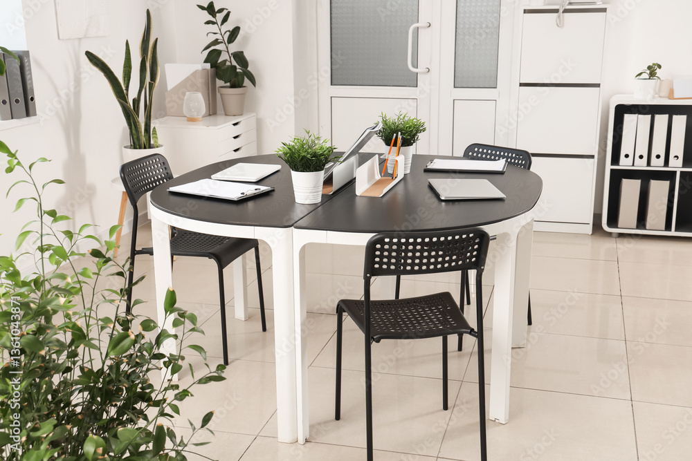 Fototapeta premium Interior of modern office with workplace and plants