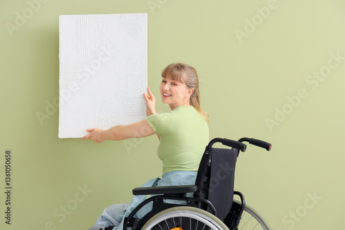 Young woman in wheelchair h...