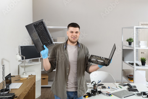Male technician with disass...