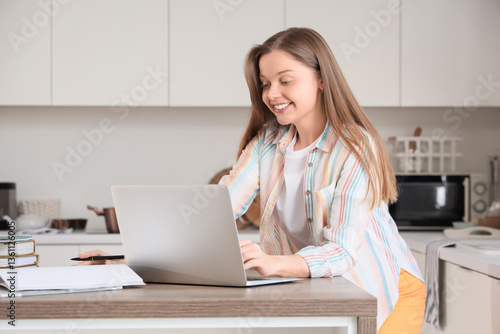 Teenage girl with laptop wo...