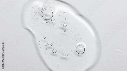Close up of a Clear Liquid  Serum cosmetic product for skin. Gel texture with bubbles