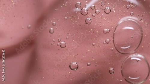 Close up of a Clear Liquid  Serum cosmetic product for skin. Gel texture with bubbles