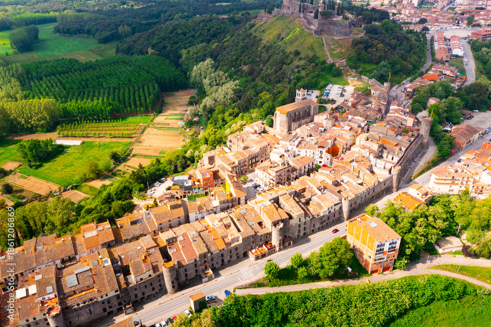 Fototapeta premium View from drone of spanish village Hostalric with Parish church of Santa Maria