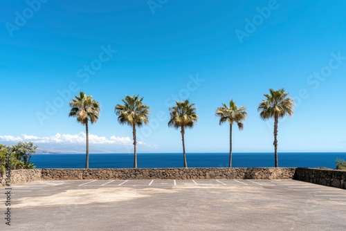 Fototapeta Naklejka Na Ścianę i Meble -  Empty parking lot with palm trees by the ocean