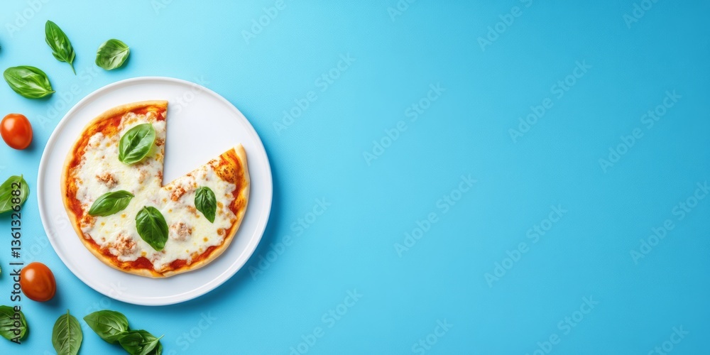 Small pizza with basil leaves on a white plate Small pizza with basil leaves on a white plate