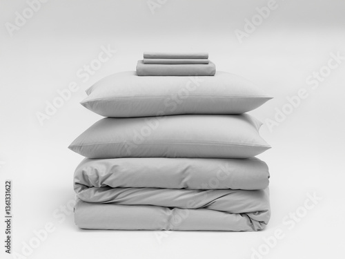 Close-up photo of beddings stack on a white background