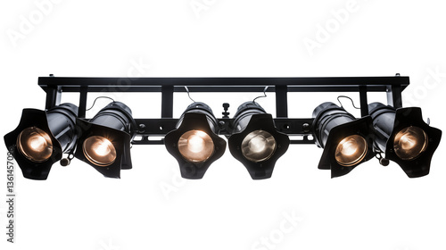 A row of stage lights illuminating a dark performance space