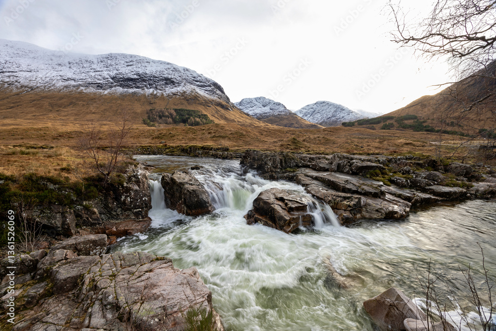 Obraz premium Skyfall Waterfall at the scenic drive through the Glencoe Valley in Scotland, United Kingdom