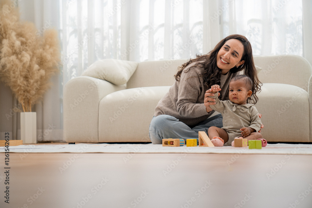 Mother and child enjoying playtime at home in a cozy living room filled with natural light during the day Mother and child enjoying playtime at home in a cozy living room filled with natural light during the day