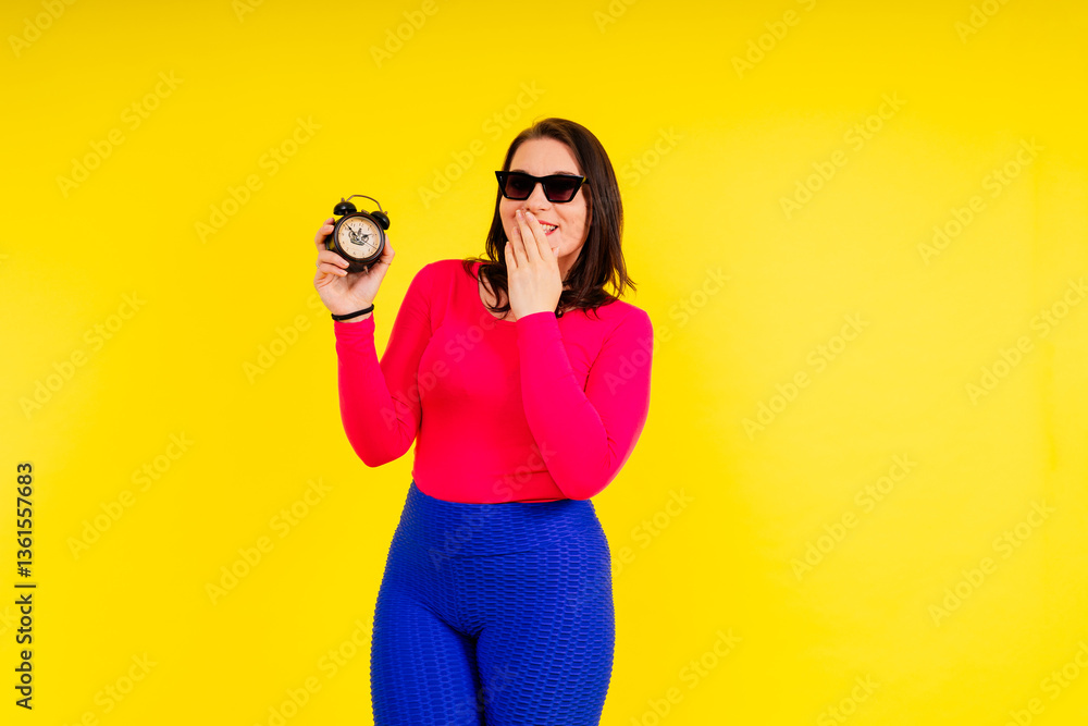 Fototapeta premium Full length photo of a young smiling fat overweight woman wearing sportswear