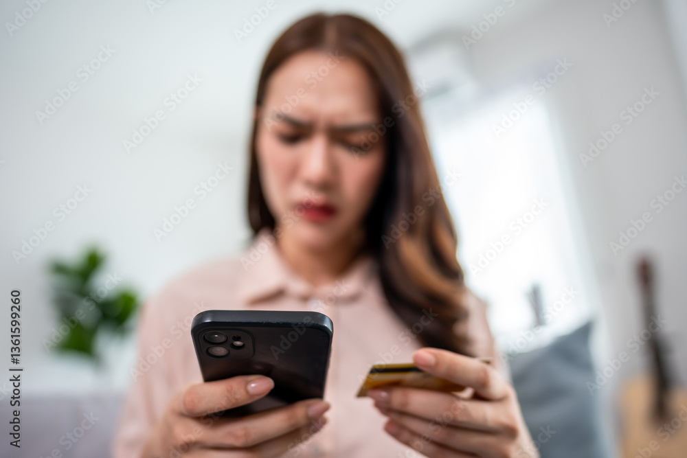 Asian frustrated woman making online payment failure on phone at home. Asian frustrated woman making online payment failure on phone at home.
