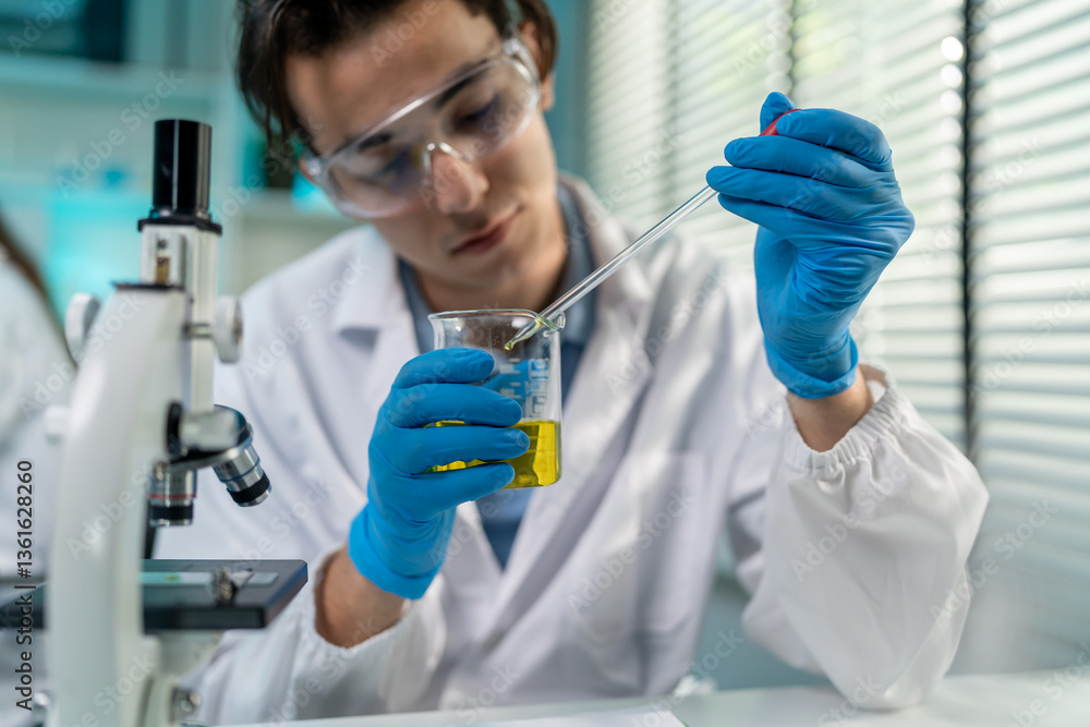 Asian male scientist working in the biotechnology research laboratory. Asian male scientist working in the biotechnology research laboratory.