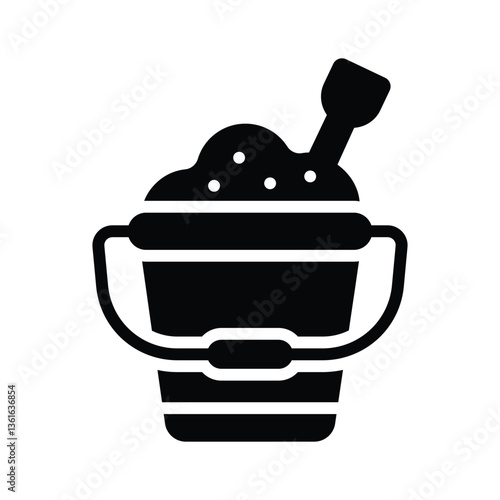 A sand bucket representing beach activities and vacations.