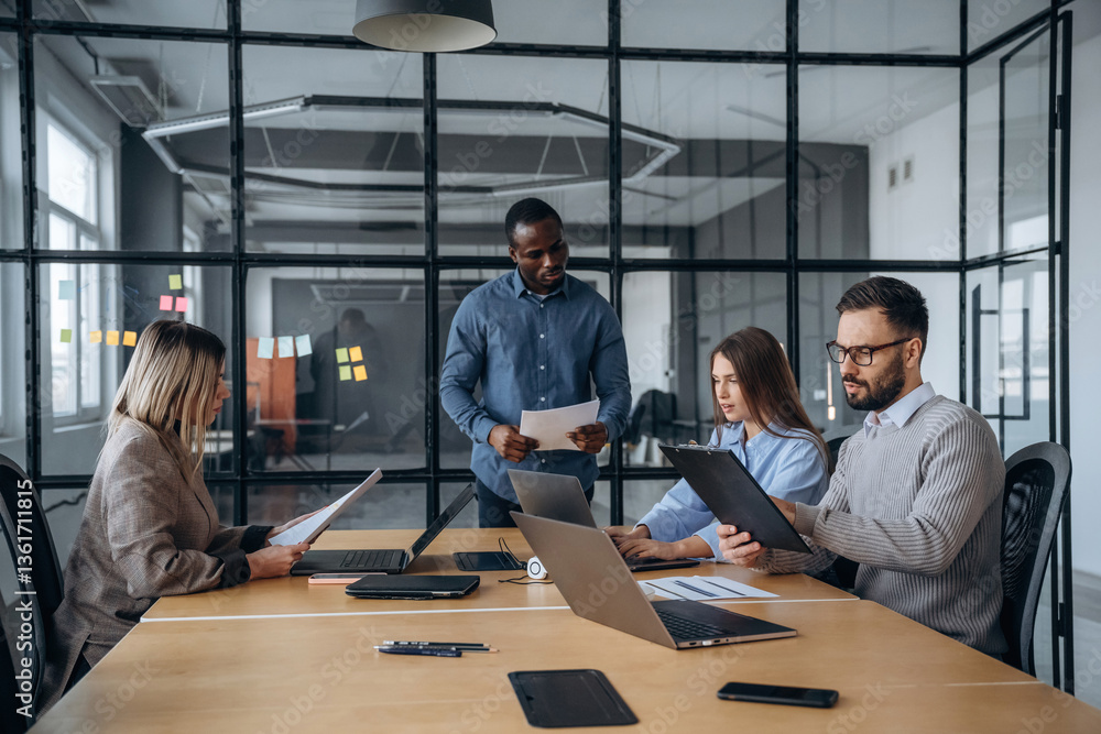 Business conception. Professional workers are in the modern office together Business conception. Professional workers are in the modern office together