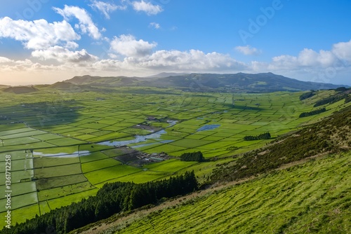 Obraz na płótnie Terceira's Rural Beauty: Serra de Cume Vista. Scenic overlook of cultivated fields in Serra de Cume, Terceira, Azores.Panoramic view of green patchwork fields at sunset. w salonie