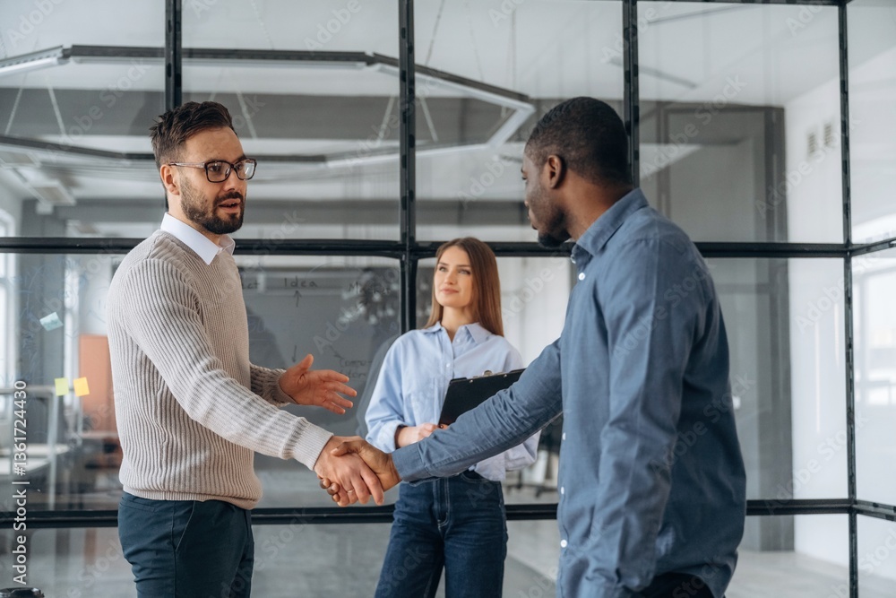 Happy to meet you, handshake. Professional workers are in the modern office together Happy to meet you, handshake. Professional workers are in the modern office together
