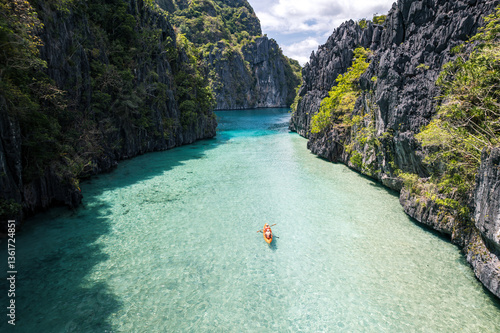 Travel background with lagoon and kayak in tropical islands of Philippines