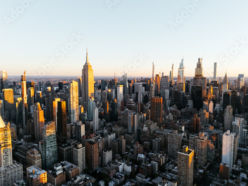 Aerial photo of Manhattan downtown from above at sunrise without clouds. New York, USA.