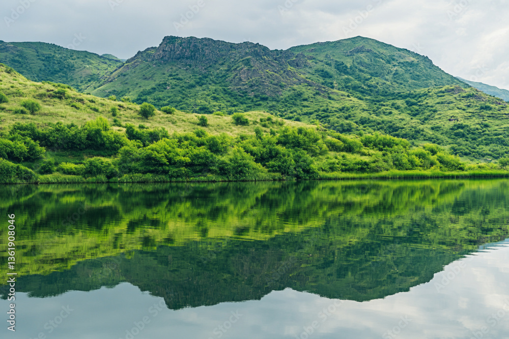 There is a lake with a mountain in the background There is a lake with a mountain in the background