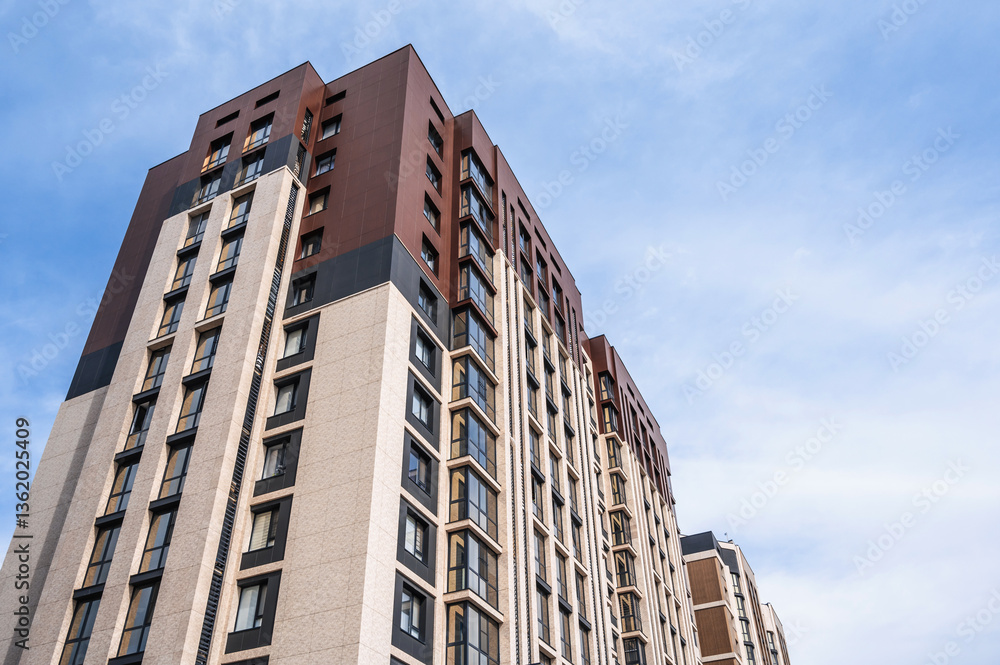 Modern apartment building on a sunny day with a blue sky. Modern apartment building on a sunny day with a blue sky.