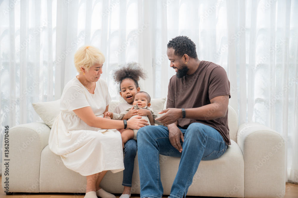 Family enjoying quality time together on a cozy couch in a bright living room during the afternoon Family enjoying quality time together on a cozy couch in a bright living room during the afternoon