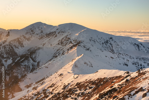Obraz na płótnie Snow-covered peaks of the Tatra Mountains with Kasprowy Wierch in winter. Stunning alpine scenery, perfect for skiing, hiking, and photography. Cold, crisp air and breathtaking views w salonie