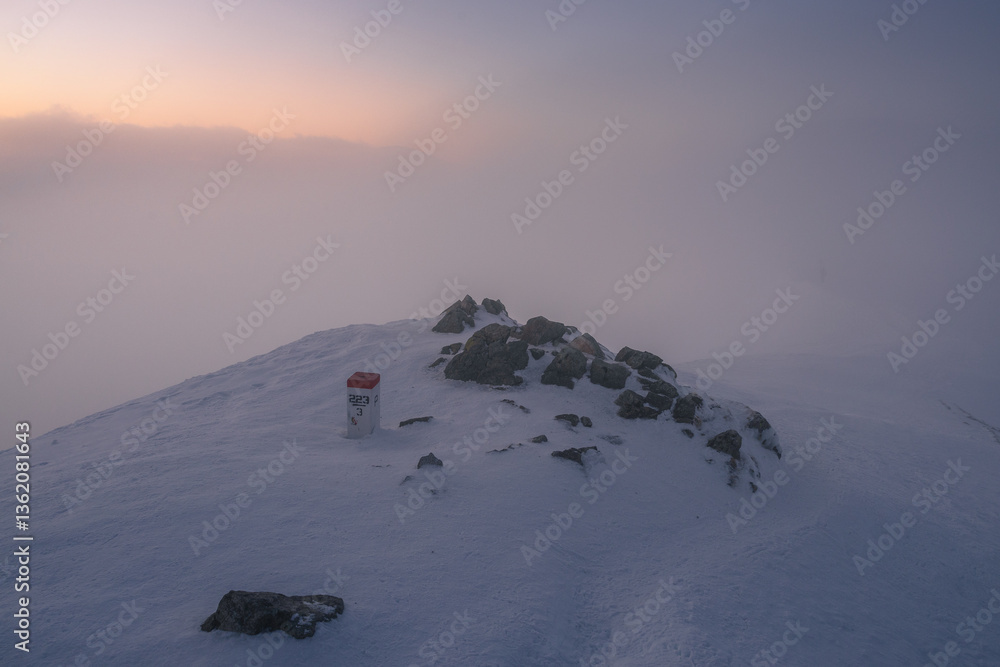 Snow-covered peaks of the Tatra Mountains with Kasprowy Wierch in winter. Stunning alpine scenery, perfect for skiing, hiking, and photography. Cold, crisp air and breathtaking views