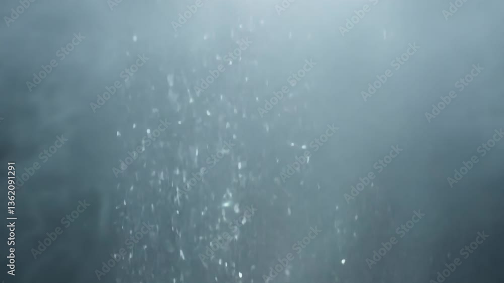 A soft mist of water droplets drifts through the air, catching the light and creating a hazy, dreamlike atmosphere. The suspended particles add a sense of tranquility and depth.
A soft mist of water droplets drifts through the air, catching the light and creating a hazy, dreamlike atmosphere. The suspended particles add a sense of tranquility and depth.