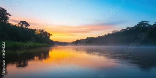 A calm lake with a beautiful orange and pink sky in the background. The water is still and the sky is clear