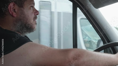 A fatigued truck driver struggles to stay awake before dangerously nodding off while driving, putting himself and others at great risk.