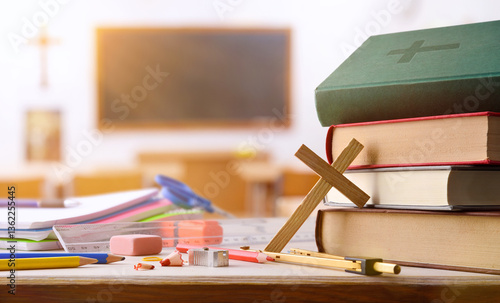 Canvas Print Educational supplies and religious objects on table with classroom background