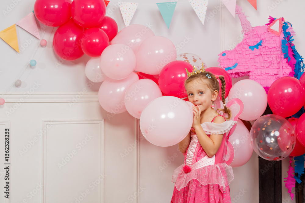 Party fun with little girl blow balloons celebrating her bday