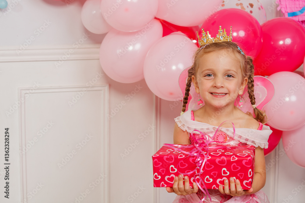 Happy bday girl laughing in crown holding pink birthday present