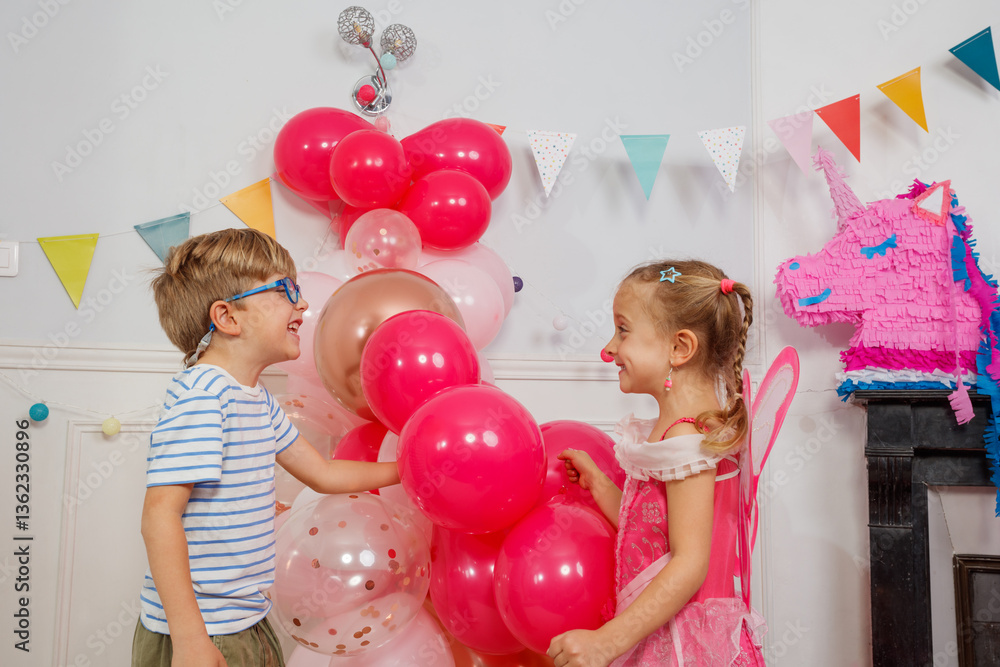 Children having a great time with balloons look at each other
