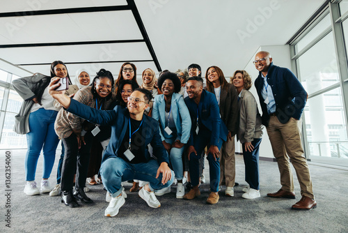 Fotografi Corporate team group photo in modern office, collaborating and smiling together