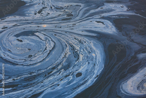 The view from above of a layer of oil, a slick on the waters of Puget Sound.