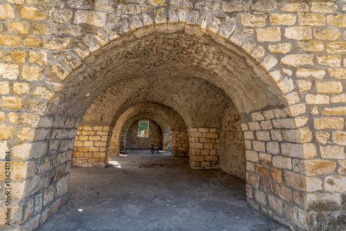 Wallpaper Mural Building with arches and a bench next to the Lady of Kafr Bir’im Maronite Church at Bar'am National Park in northern Israel near the Lebanese border.
 Torontodigital.ca