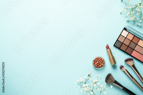 Make up flat lay background on blue.