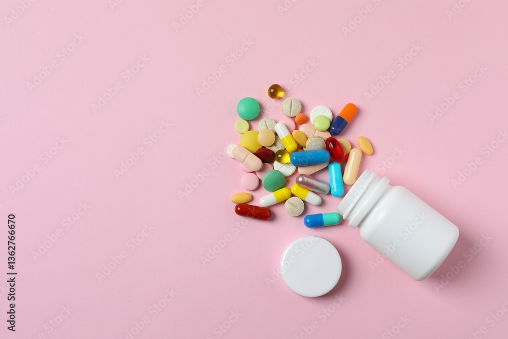 Various pills with white bottle on color background, top view Various pills with white bottle on color background, top view
