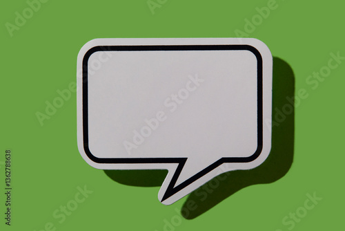 Blank thought bubble on green background